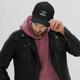 Structured twill cap with six-panel design, curved brim, breathable eyelets, and adjustable back strap for everyday wear