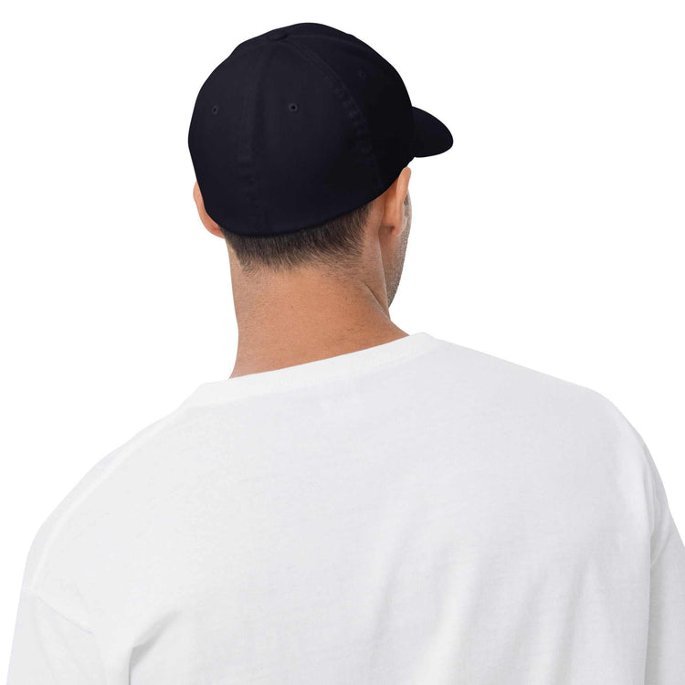 Structured twill cap with six-panel design, curved brim, breathable eyelets, and adjustable back strap for everyday wear