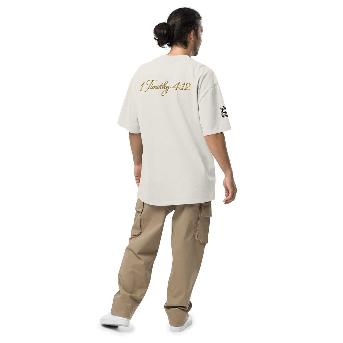 Model wearing oversized signature tee in casual streetwear style