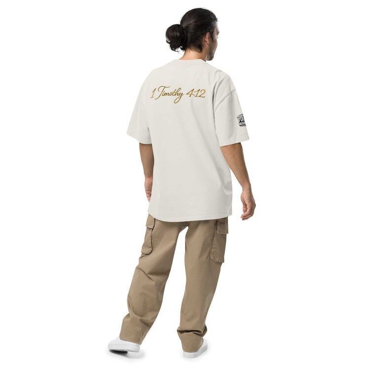 Model wearing oversized signature tee in casual streetwear style