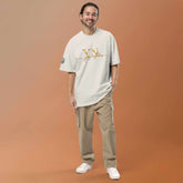 Man wearing oversized signature tee in casual urban setting showcasing relaxed fit and breathable fabric