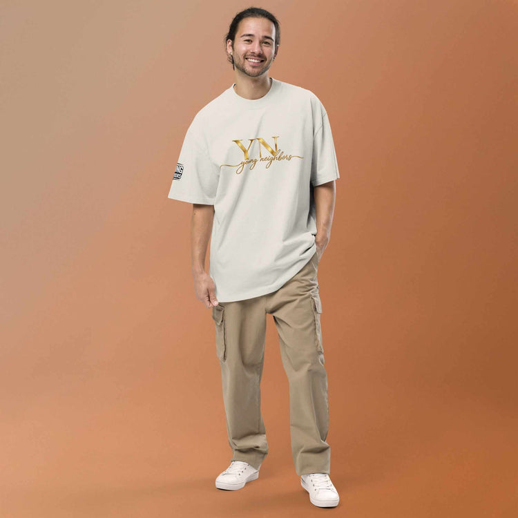 Man wearing oversized signature tee in casual urban setting showcasing relaxed fit and breathable fabric
