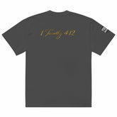 Close-up of oversized signature tee in premium cotton with ribbed crew neckline and relaxed fit
