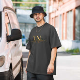 Unisex oversized signature tee made of premium cotton with relaxed fit and ribbed crew neckline for casual streetwear style