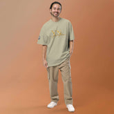Man wearing oversized signature tee in a relaxed streetwear style