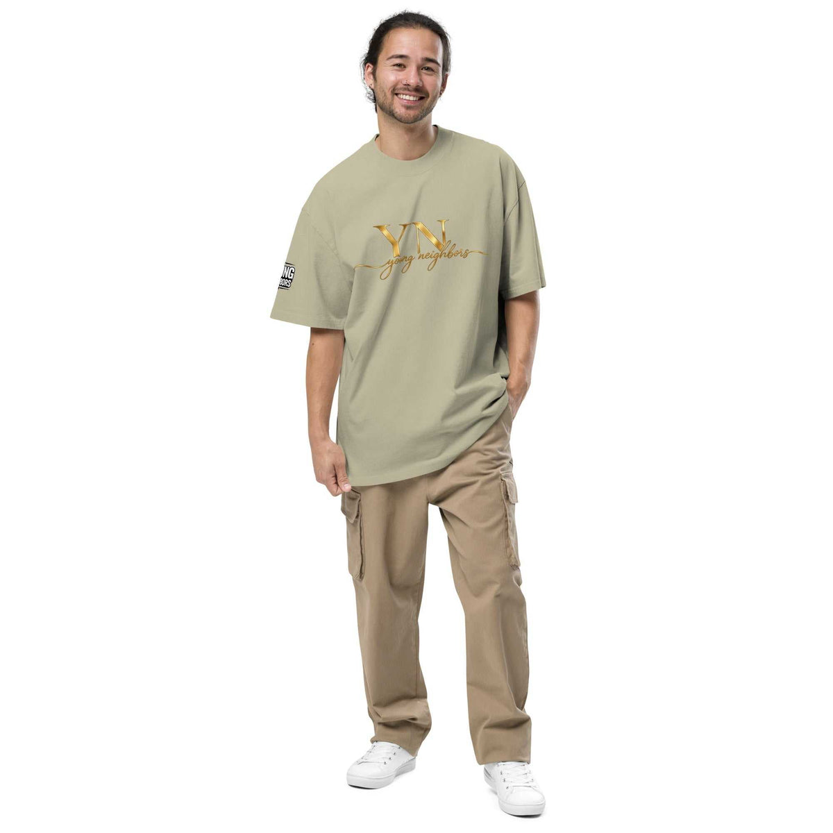 Man wearing oversized signature tee in casual streetwear style outdoors