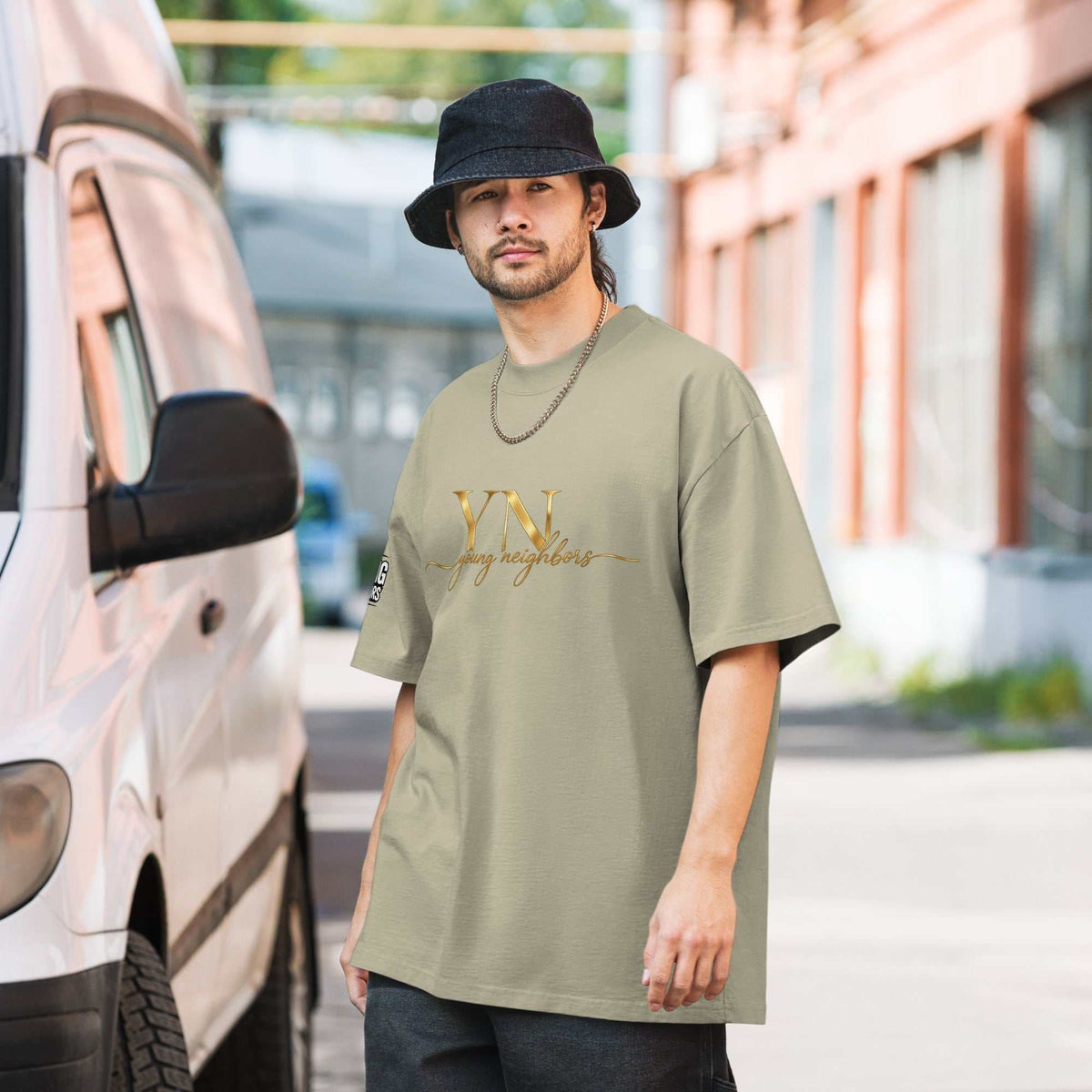 Unisex oversized signature tee in premium cotton with relaxed fit and ribbed crew neckline for casual streetwear style