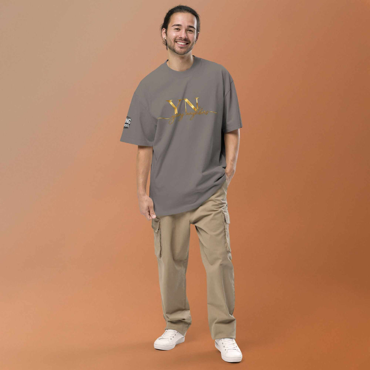 Oversized Signature Tee in premium cotton with relaxed fit and ribbed crew neckline for all-day comfort and style