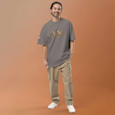 Oversized Signature Tee in premium cotton with relaxed fit and ribbed crew neckline for all-day comfort and style