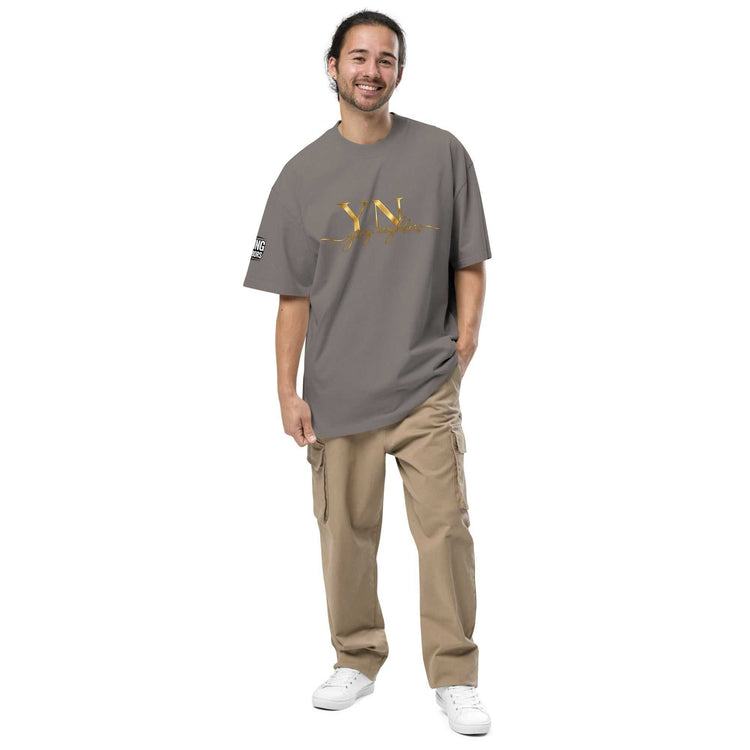 Oversized Signature Tee in premium cotton with relaxed fit and ribbed crew neckline, styled for casual streetwear.