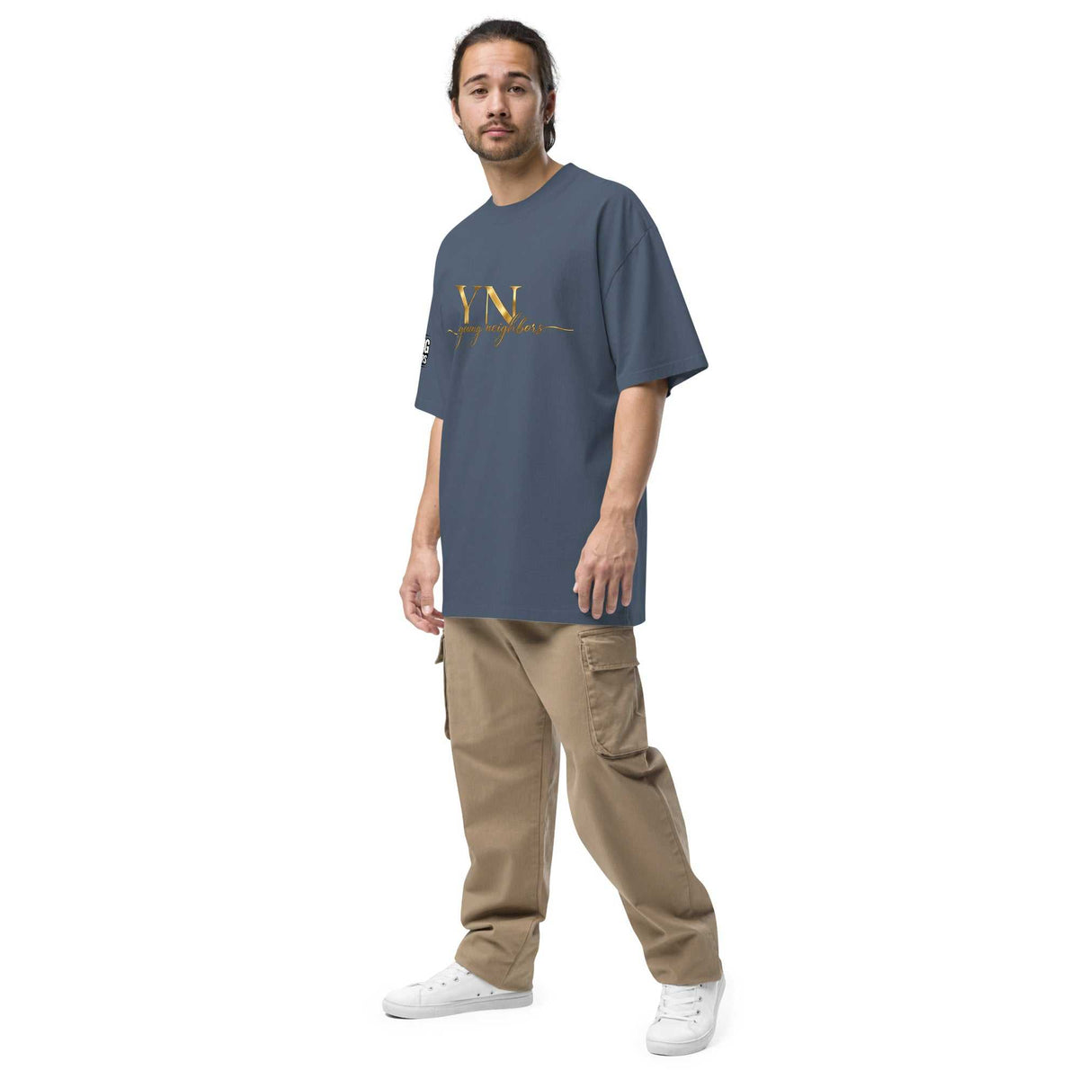 Man wearing oversized signature tee in casual streetwear style