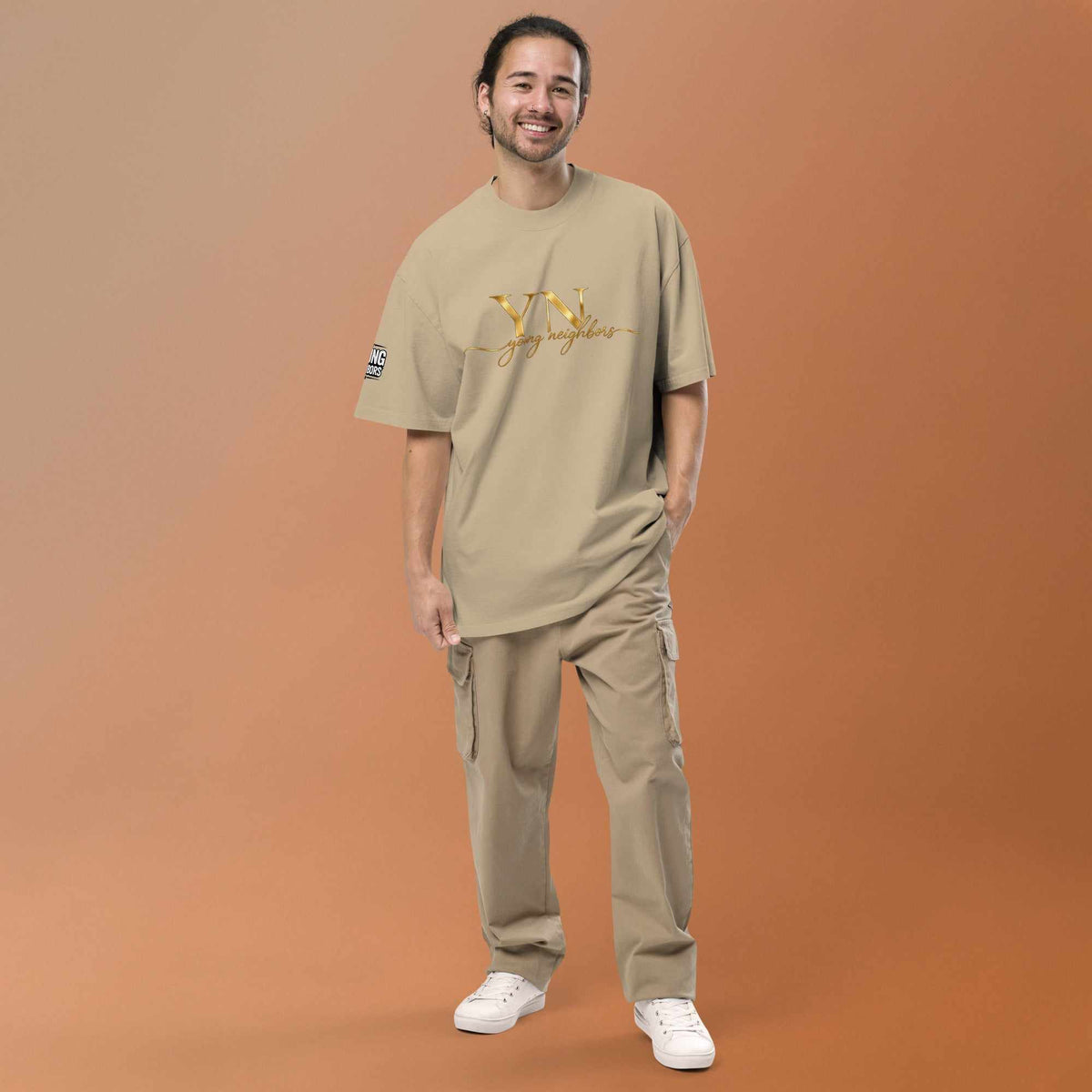 Man wearing oversized signature tee in casual streetwear style