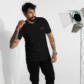 Premium Young Neighbors tee with metallic gold embroidered logo and 1 Timothy 4:12 scripture on back