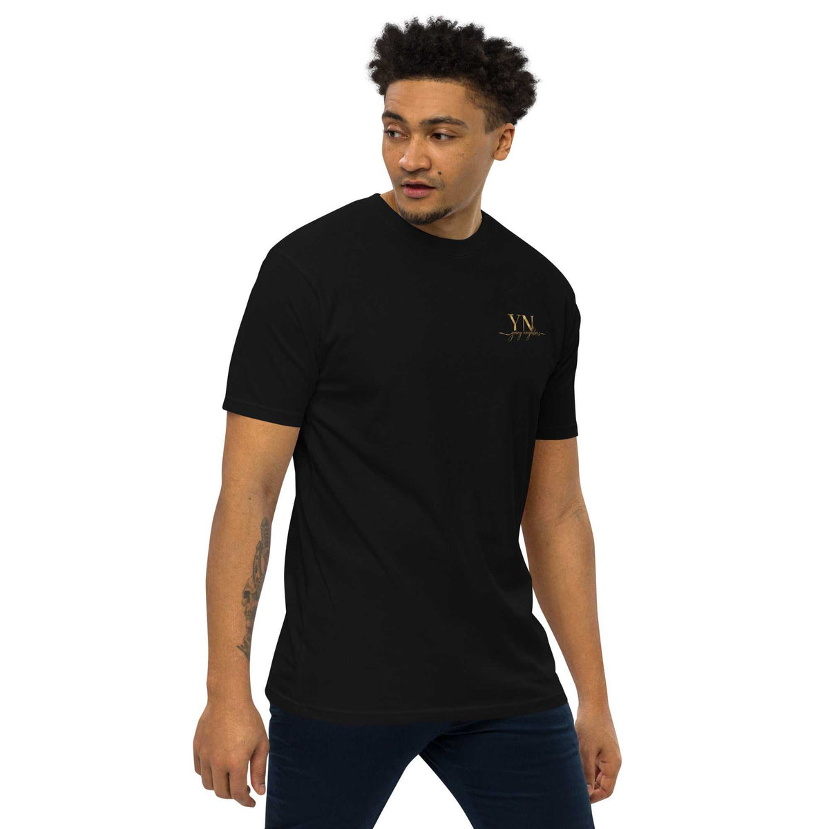 Black premium Young Neighbors tee with metallic gold embroidered logo and 1 Timothy 4:12 scripture on back