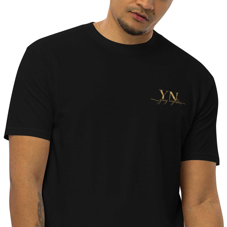 Premium Young Neighbors tee with metallic gold embroidered logo and 1 Timothy 4:12 scripture design